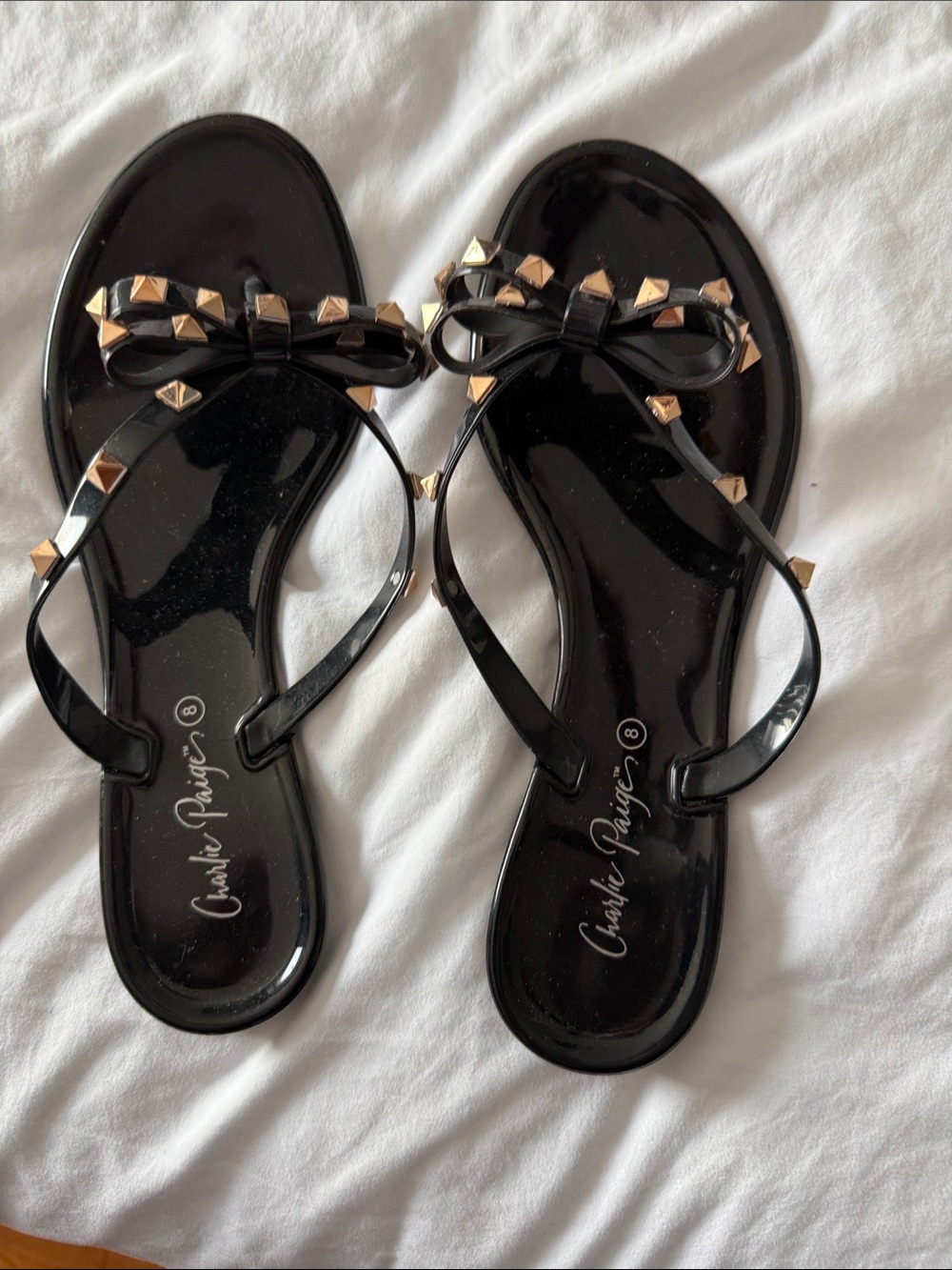 Charlie Paige Black Studded Bow Jelly Sandals with Gold Accents